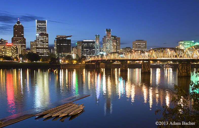 Portland Oregon skyline at night with skulling boats and wilamet