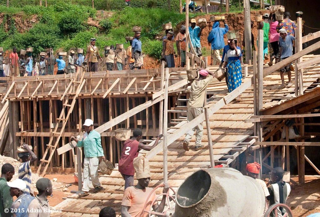 portland oregon editorial photographer in rwanda -workers building kigali parents secondary school