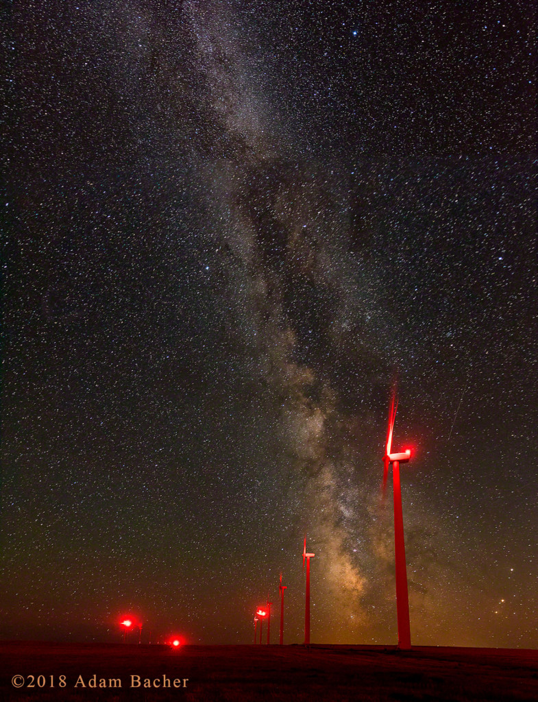 Wind turbines under the milky way and stars in Oregon.