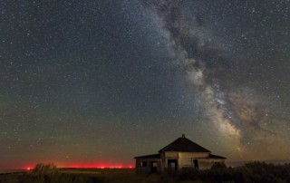 haunted sky - milky way and abandoned home in eastern oregon