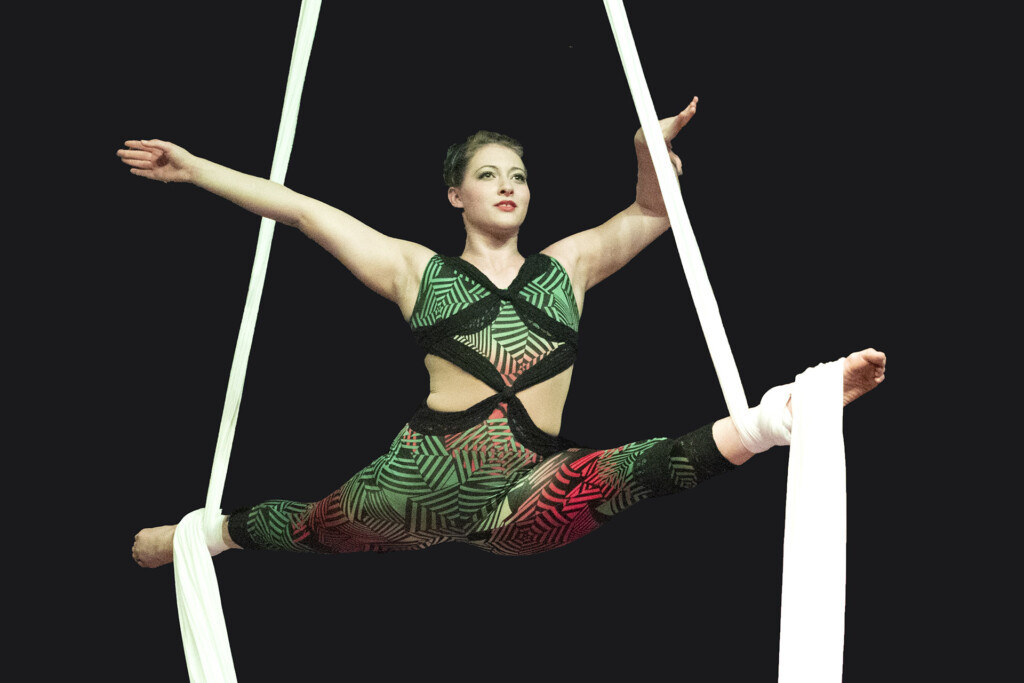 Acrobat balancing on Ropes